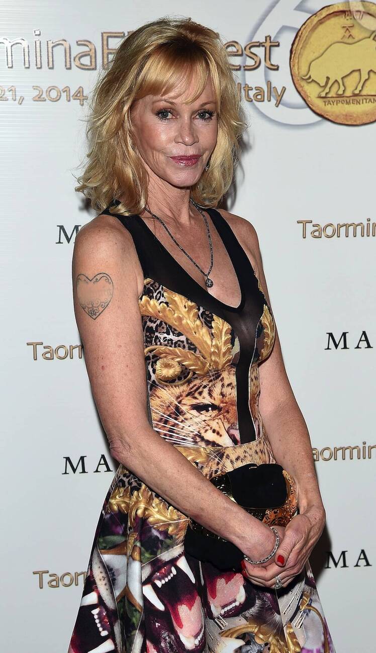 Melanie griffith covers up tattoo