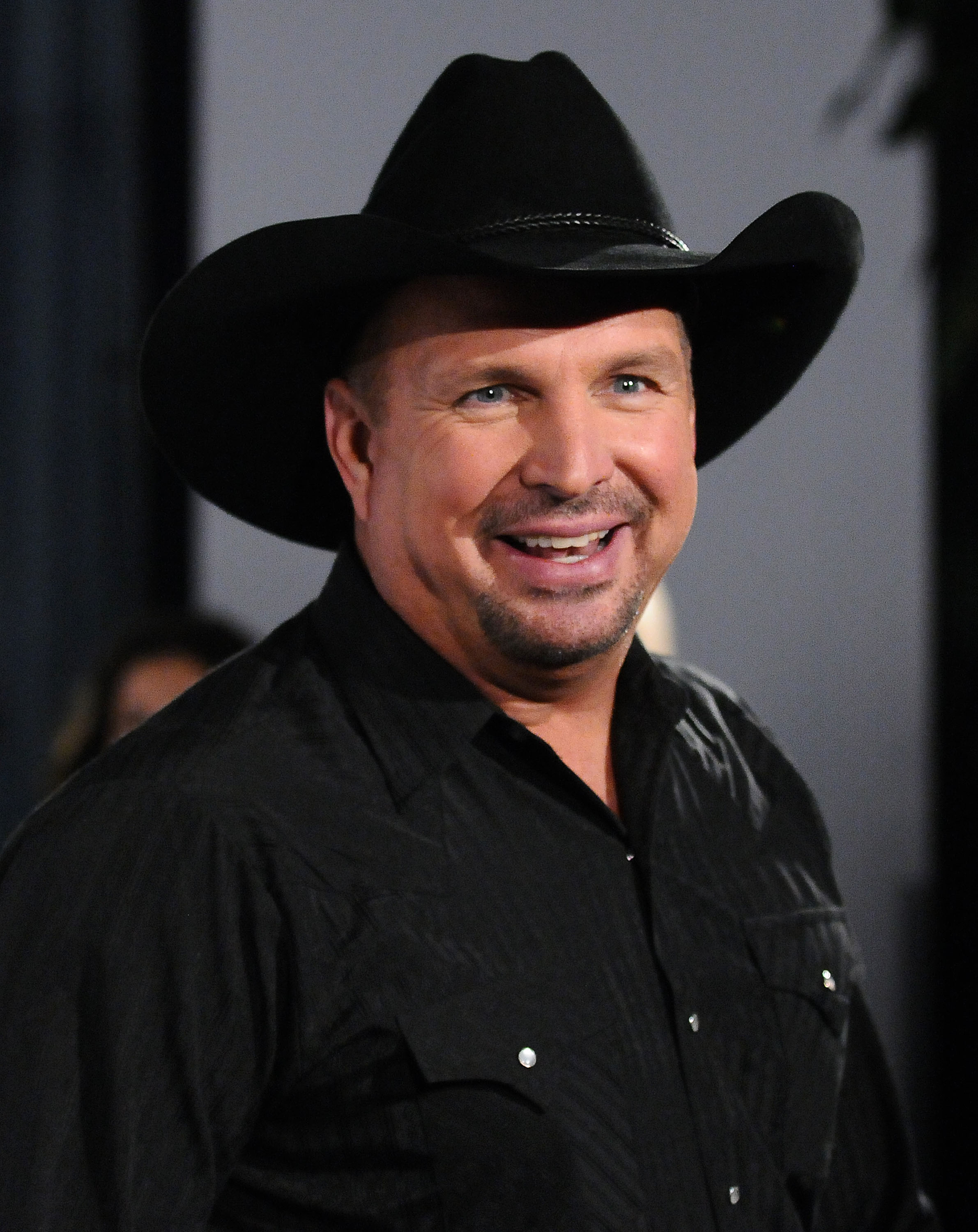 Garth Brooks Gifts His Guitar to a Fan With Cancer at Concert Closer