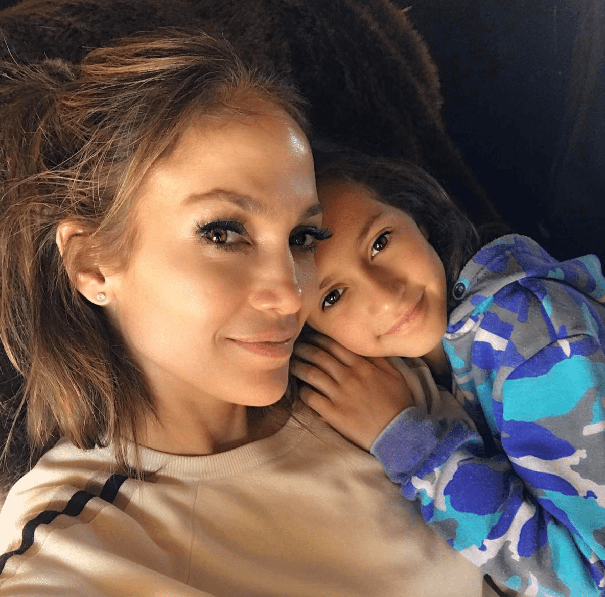 Jennifer Lopez, 49, poses with her mini me daughter Emme, 10, on Christmas