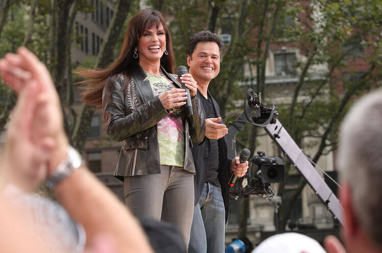 Actors and singers Marie Osmond and Donny Osmond perform on ABC's "Good Morning America" at Bryant Park 