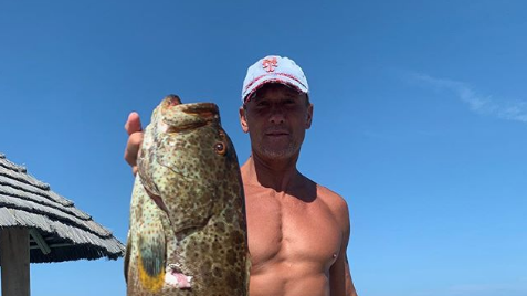 Tim McGraw Fishing Picture: Singer Shows Off Abs on Instagram