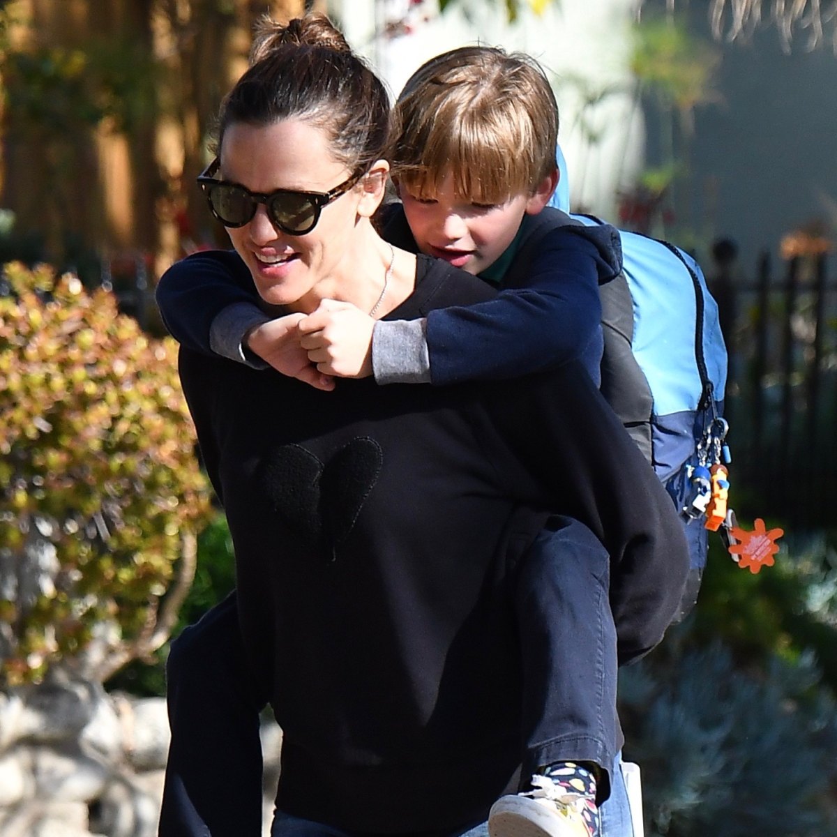 Jennifer Garner gives her son Samuel a piggyback ride after picking him up  from school in Brentwood