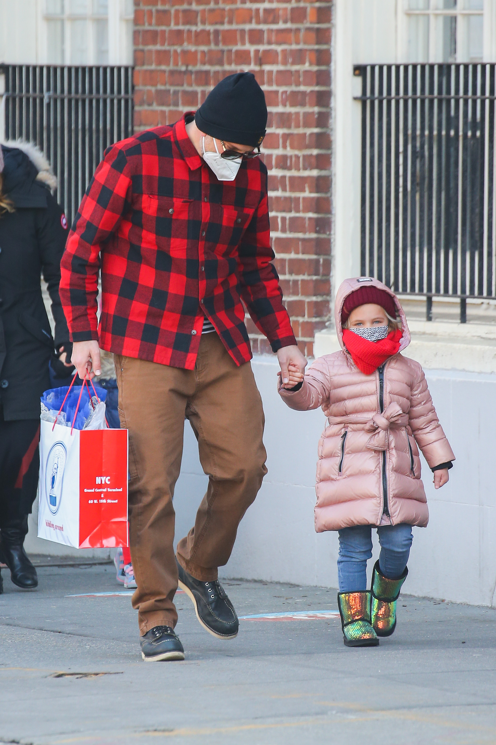 Bradley Cooper, 47, is a doting father as he holds hands with his  five-year-old daughter Lea in NYC