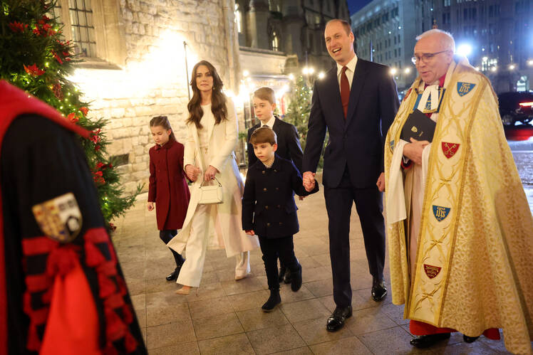Kate Middleton and Prince William hold hands with their kids