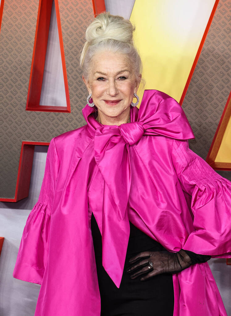 Helen Mirren wears pink cape and black gloves