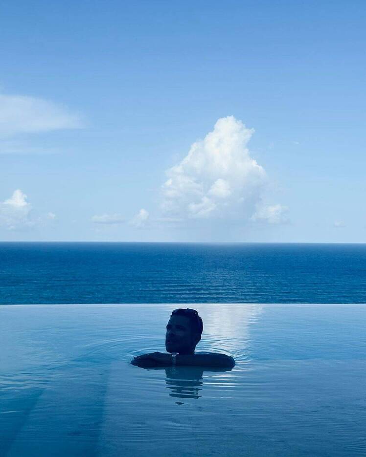 Mark Consuelos swims shirtless in a pool