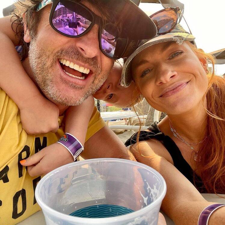 Jenn Todryk and husband Mike Todryk pose together at water park