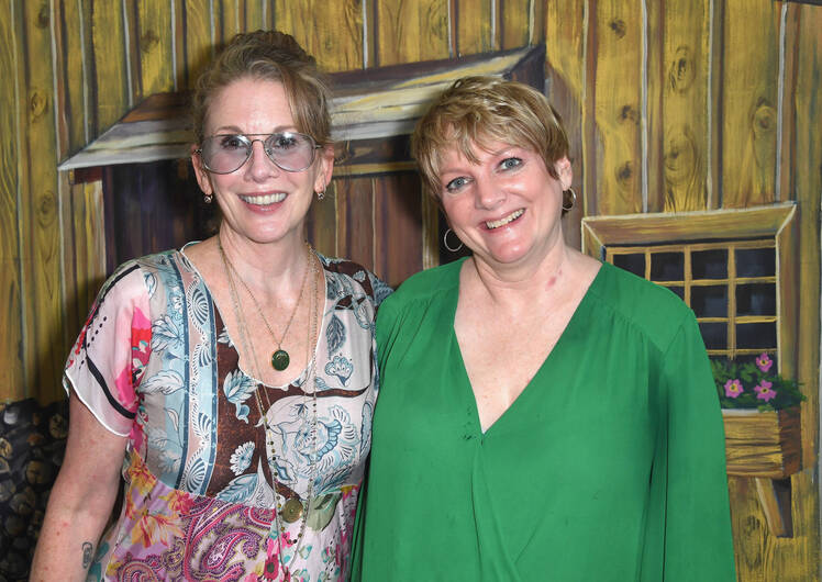 Melissa Gilbert wears sunglasses and patterned top while hugging Alison Arngrim