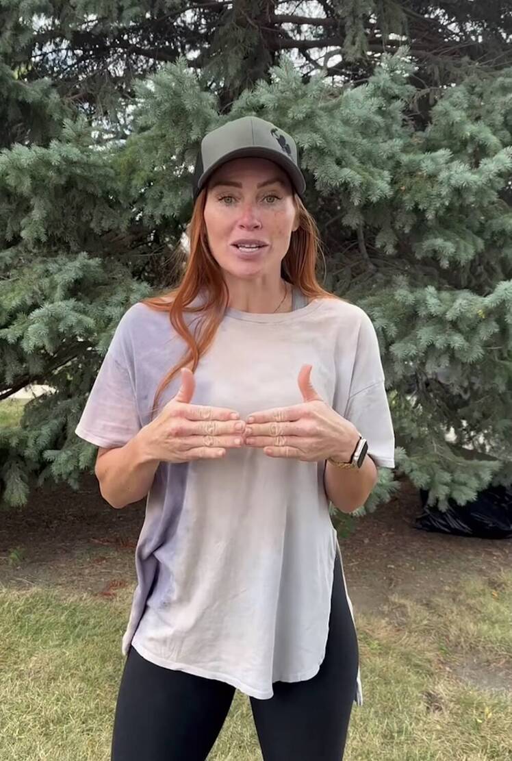 Mina Starsiak Hawk wears T-shirt and leggings with a baseball cap