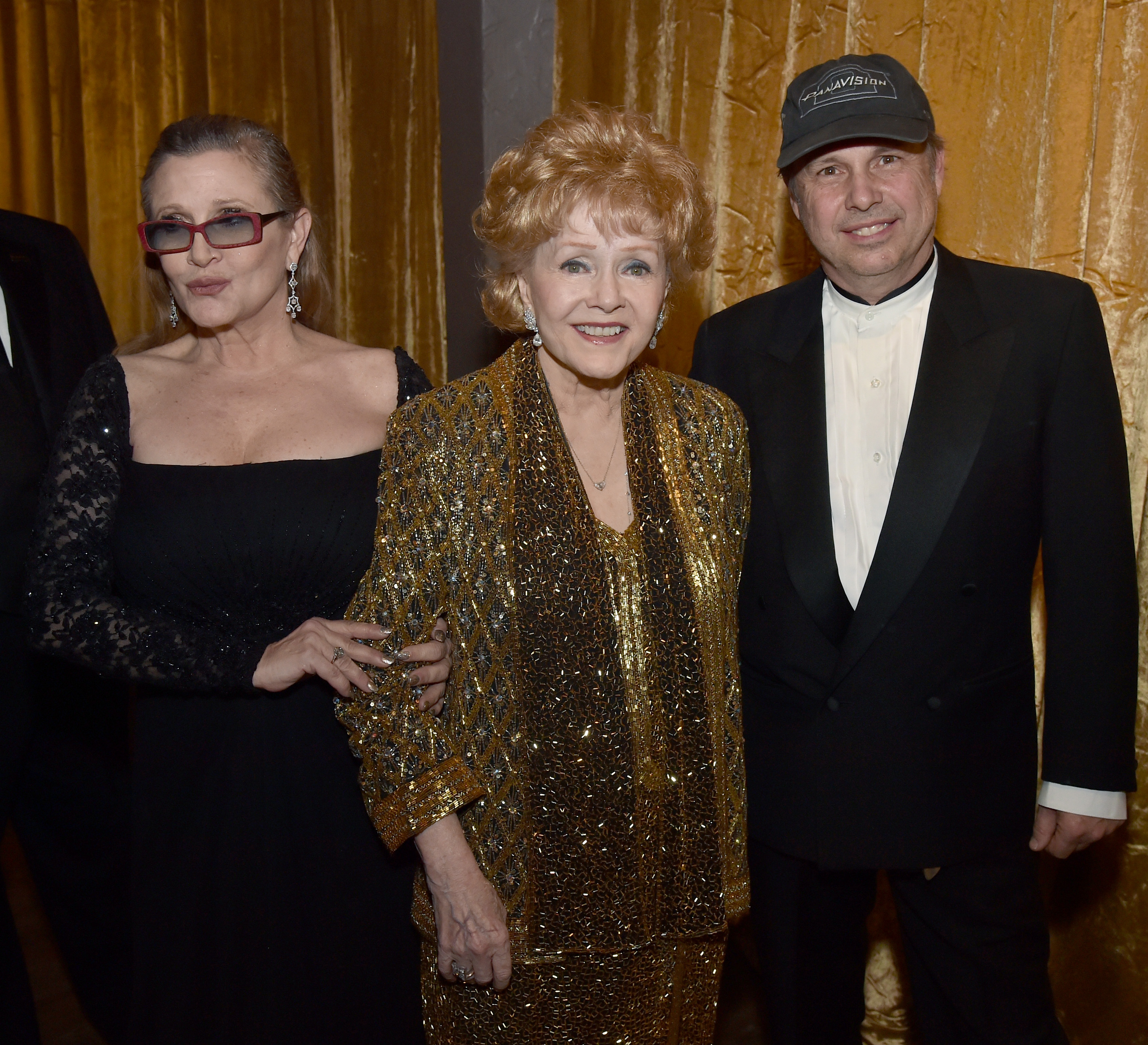 Carrie and Todd Fisher pose with mom Debbie Reynolds in Trophy Room