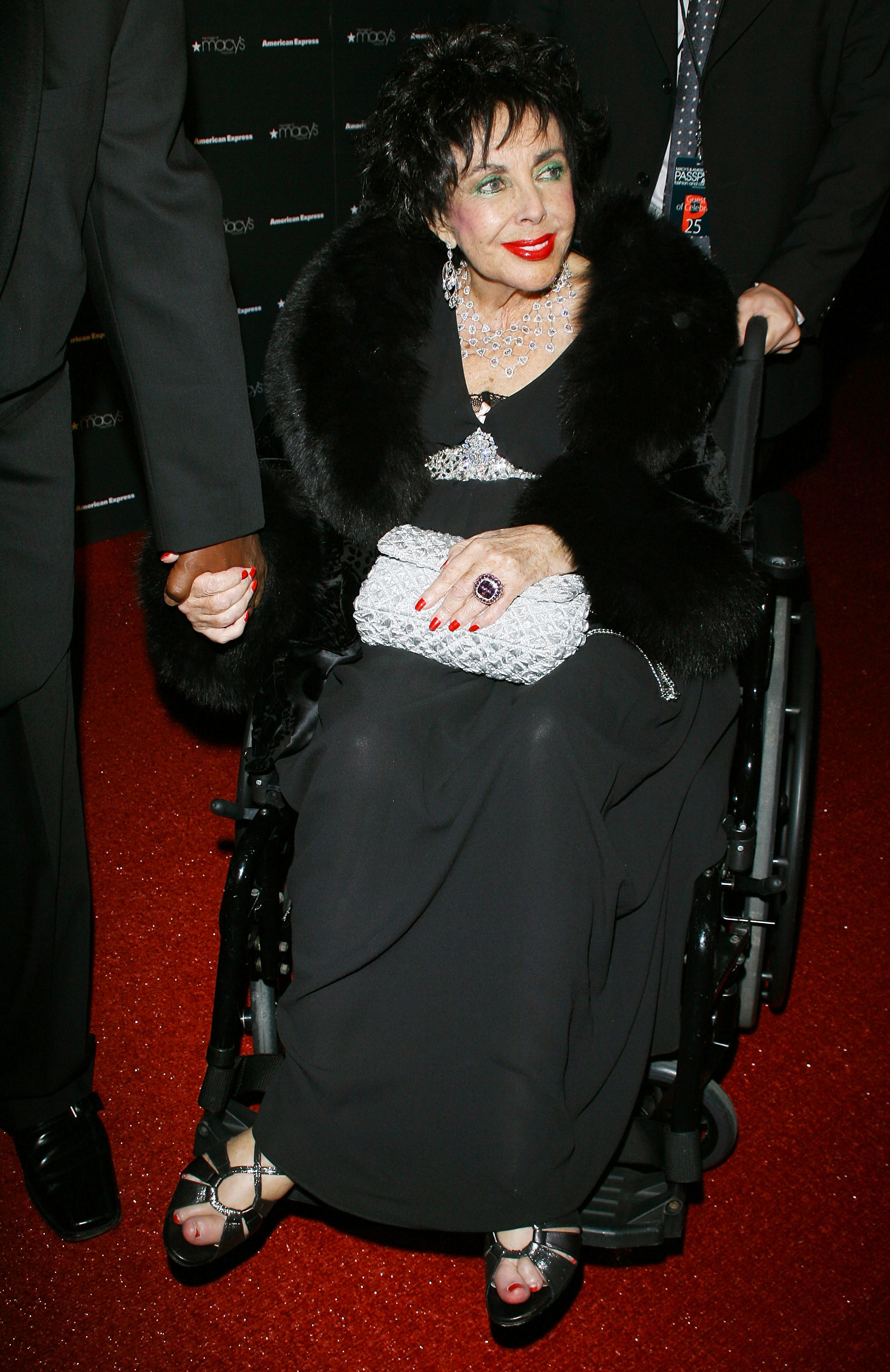 Elizabeth Taylor sits in wheelchair