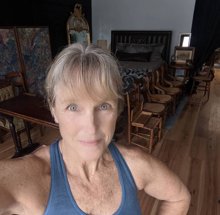 Karen E. Laine wears blue tank top