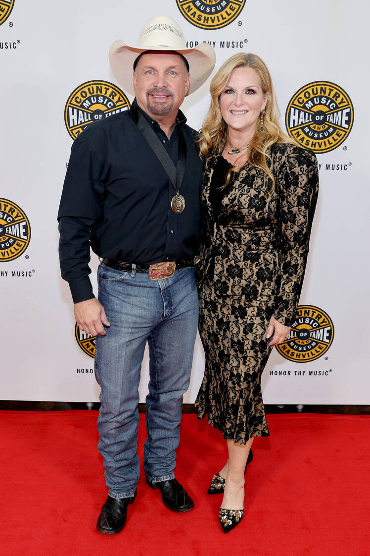 Garth Brooks smiles next to wife Trisha Yearwood