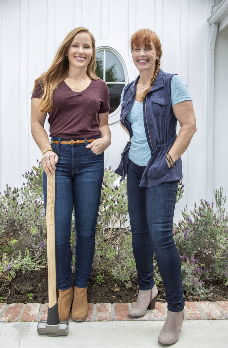 Mina Starsiak Hawk holds shovel while standing next to mom Karen E. Laine