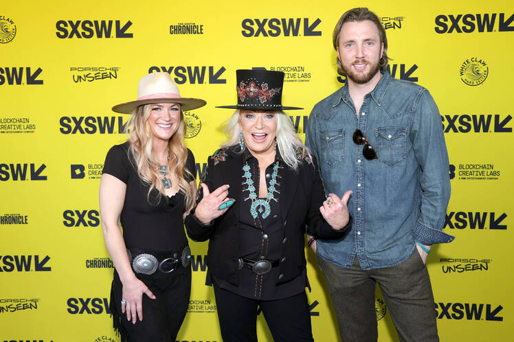 Tanya Tucker and kids Presley and Grayson poose together on red carpet