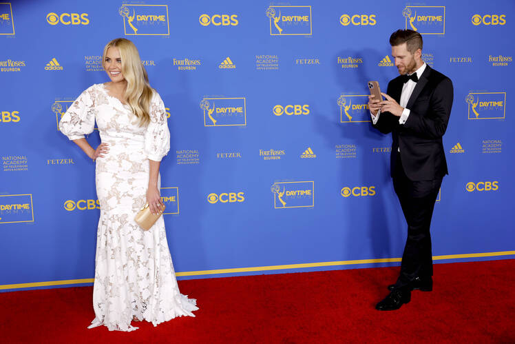 Shea McGee and Syd McGee on red carpet in formal outfits