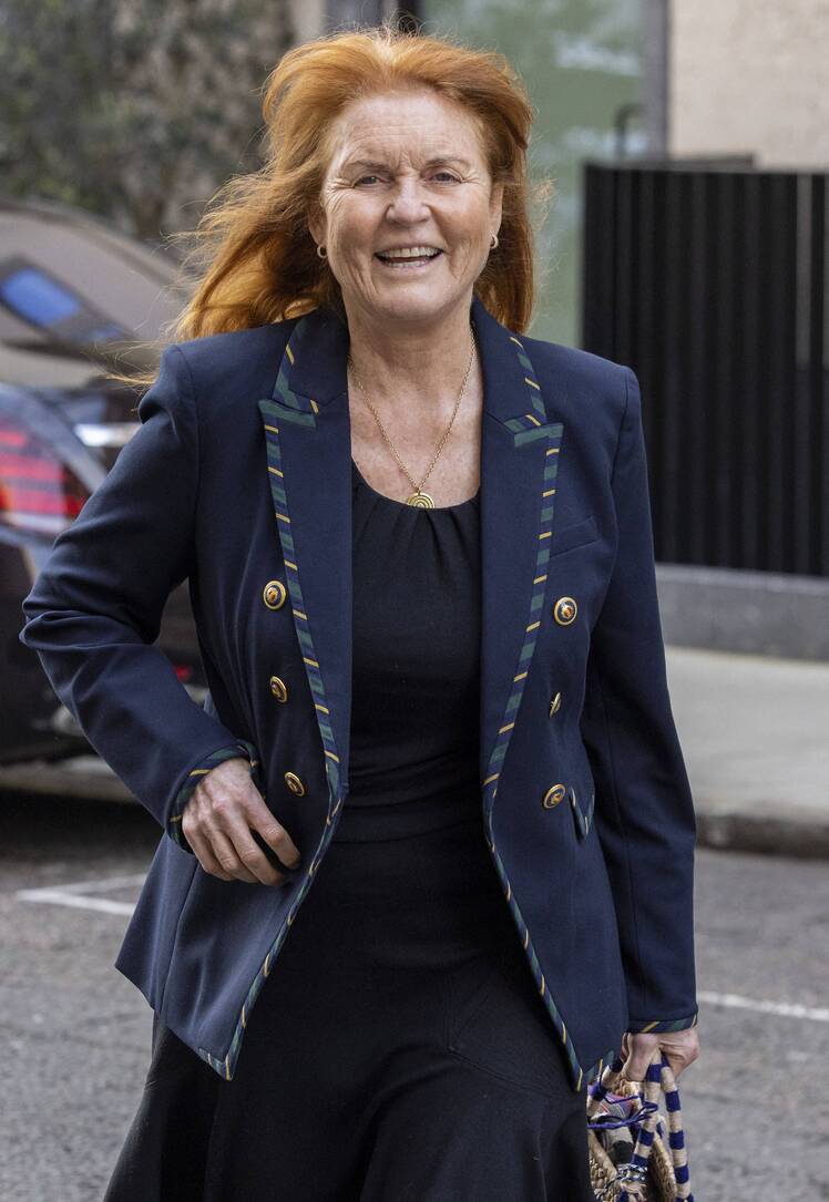 Sarah Ferguson wears a blue blazer with black pants