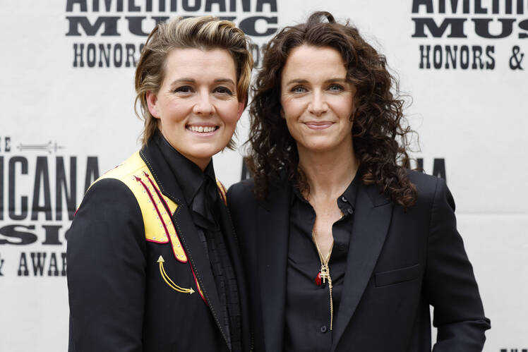 Brandi Carlile and wife Catherine Shepherd pose for a photo