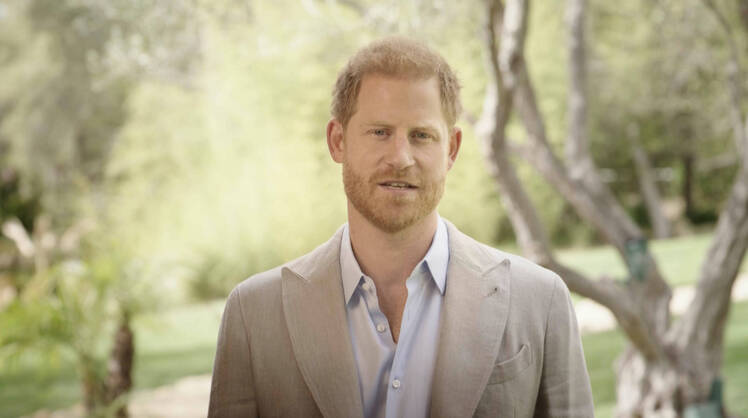 Prince Harry appears at home during award ceremony