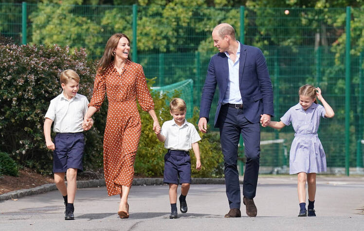 Prince George, Kate Middleton, Prince Louis, Prince William and Prince Charlotte hold hands while walking