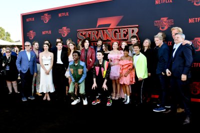 The cast and crew including Joe Keery, Winona Ryder, David Harbour, Dacre Montgomery, Sadie Sink, Millie Bobby Brown, Gaten Matarazzo, Caleb McLaughlin, Finn Wolfhard, and Noah Schnapp attend the premiere of Netflix's Stranger Things